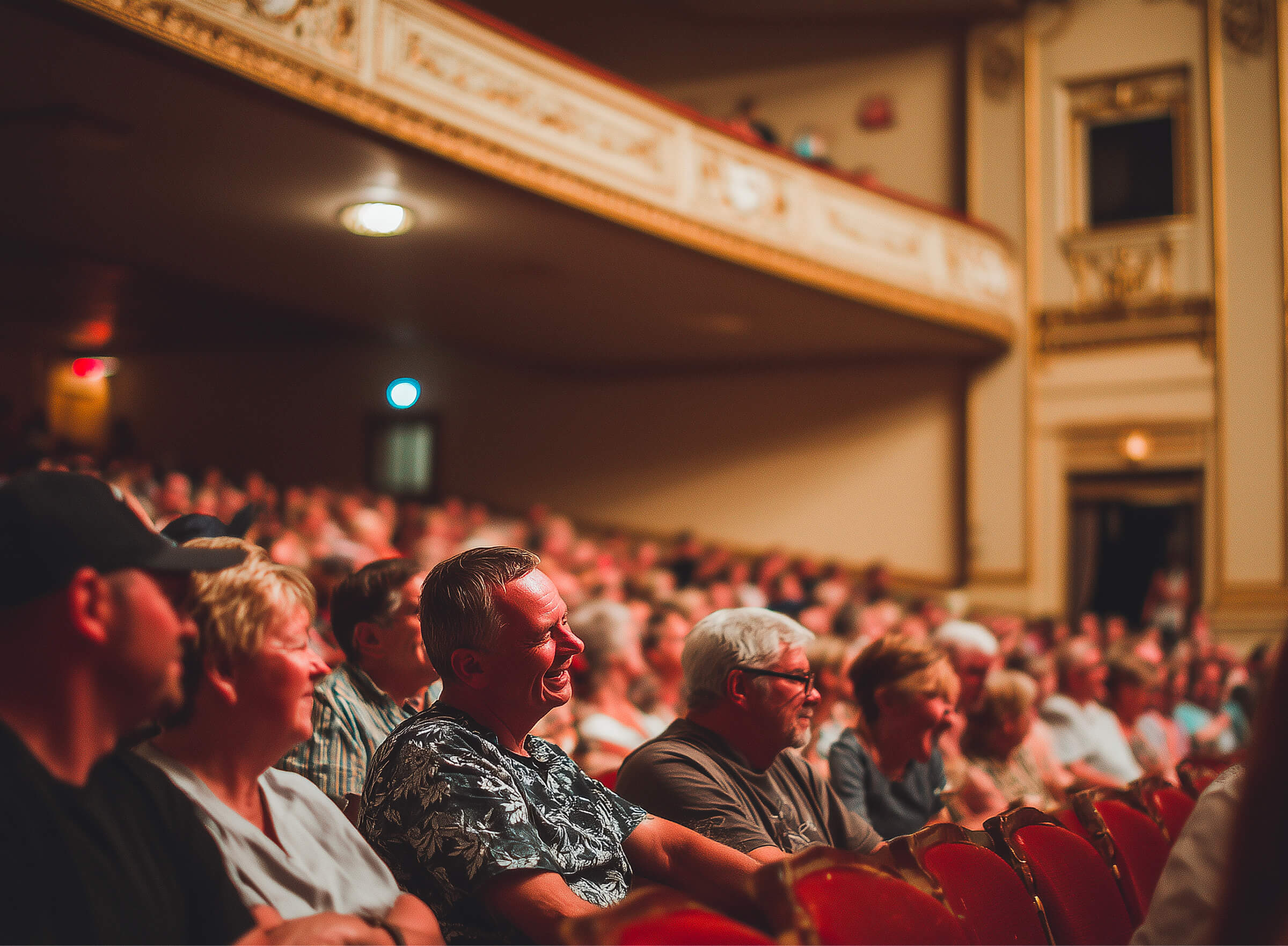 An engaged audience watching a show from their theater seats
